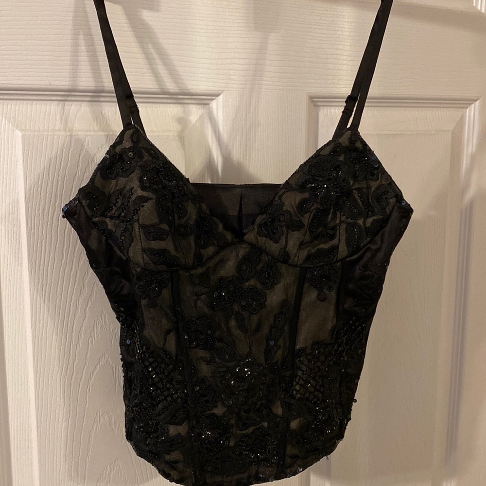 Beautifully structured, dressy camisole top with bones in the lining.